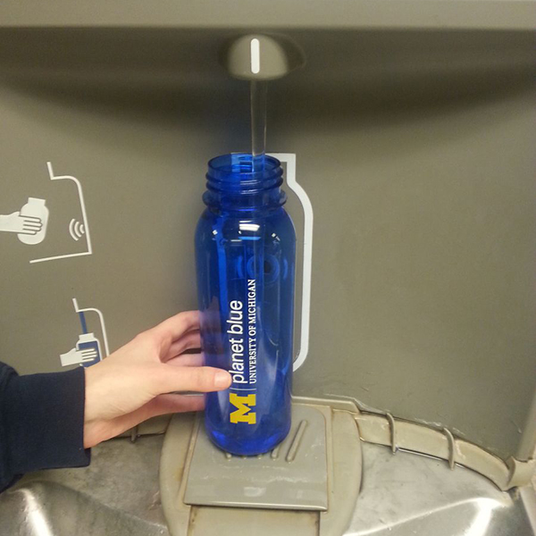 University of Michigan water bottle being filled